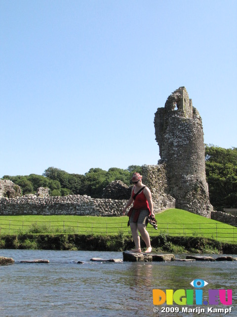 SX07970 Kristina crossing stepping stones at Ogmore Castle